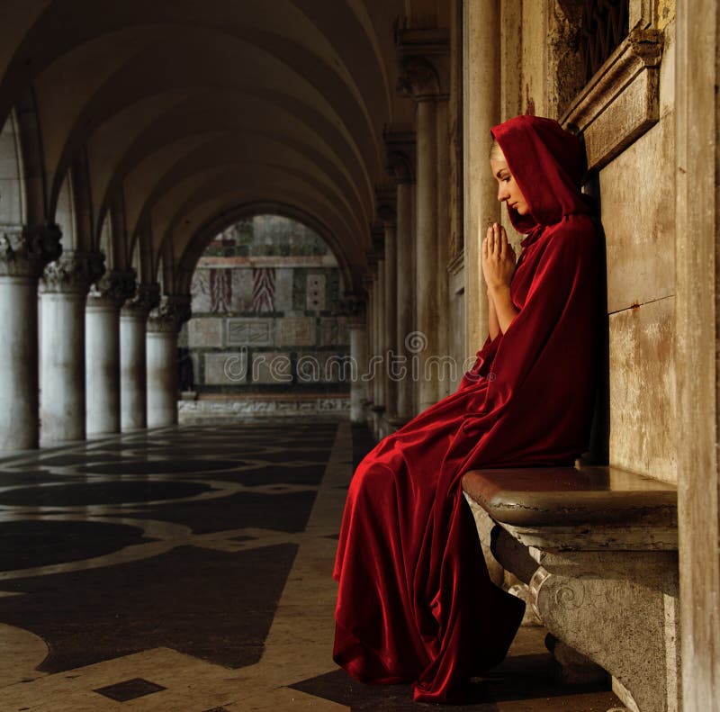 Woman in cloak outdoors