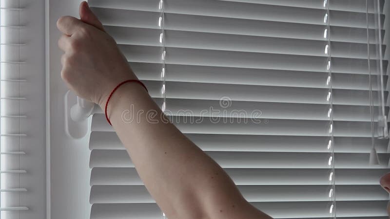 A woman close White Plastic Window By The Handle