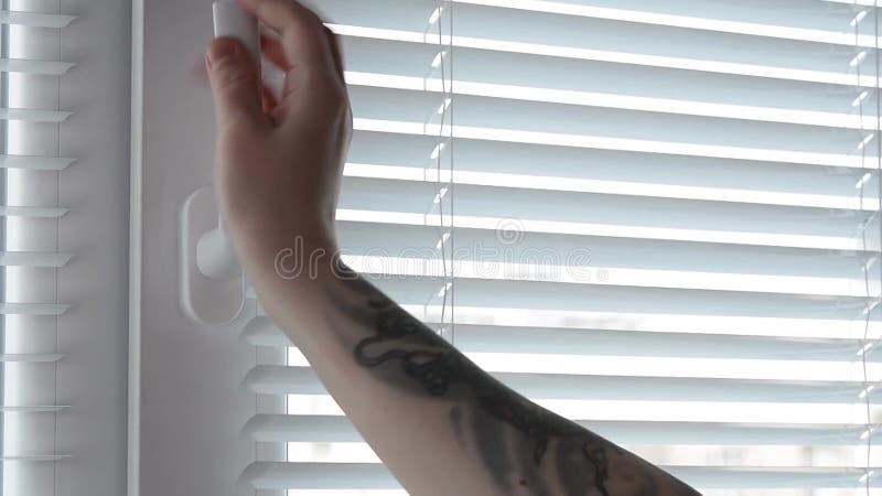 A woman close White Plastic Window By The Handle