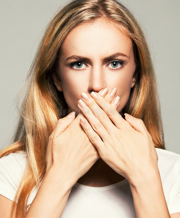 Woman with closed mouth stock photo. Image of finger - 48556398