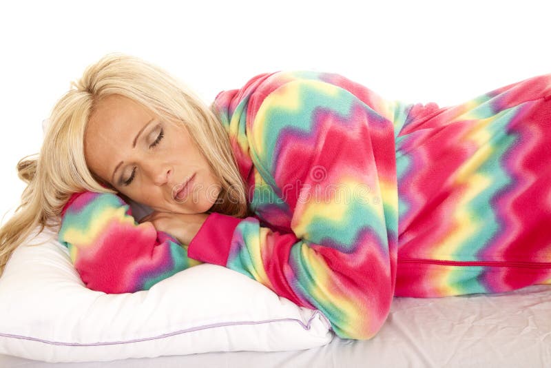 Woman in colorful pajamas lay asleep