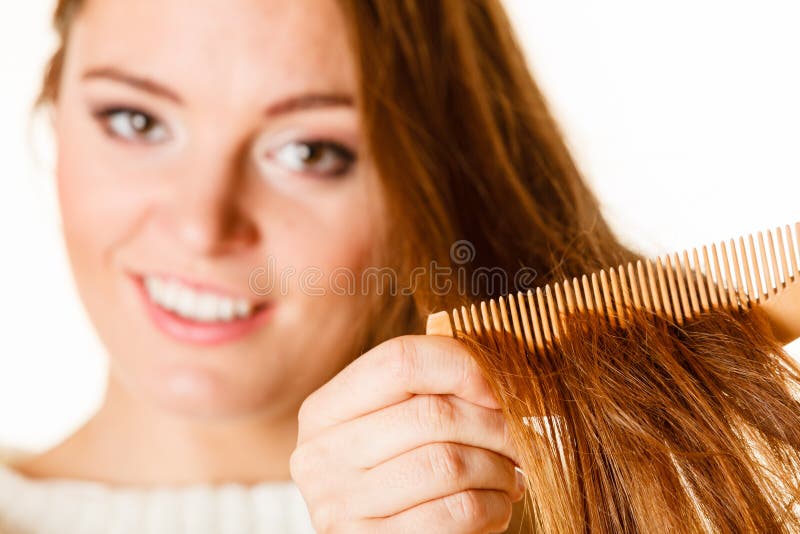 Woman Combing and Pulls Hair. Stock Photo Image of hairstyle