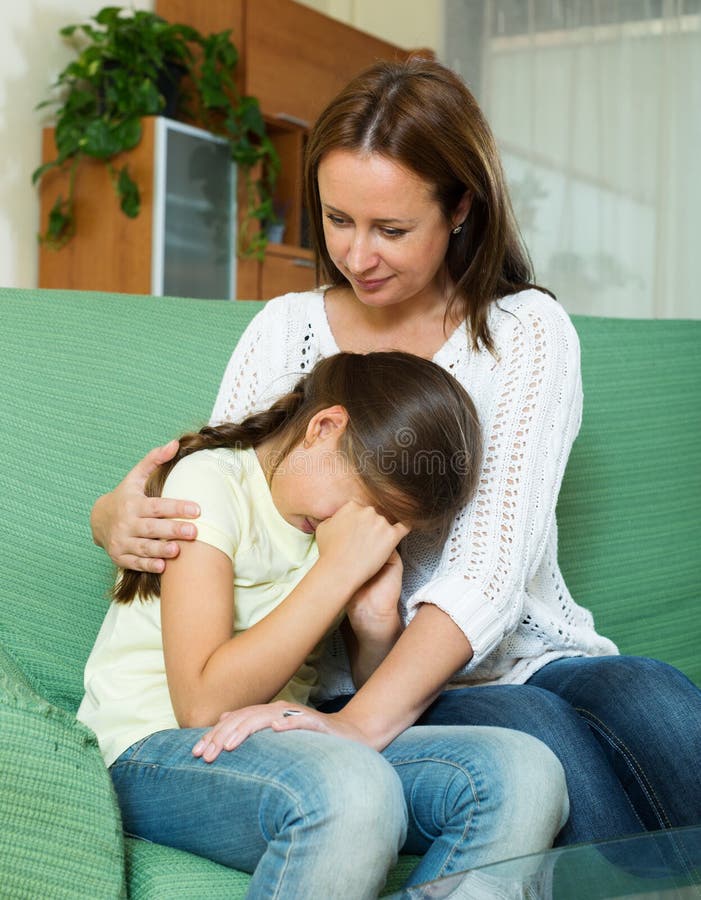Woman comforting crying daughter royalty free stock image Woman comforting crying daughter royalty free stock image