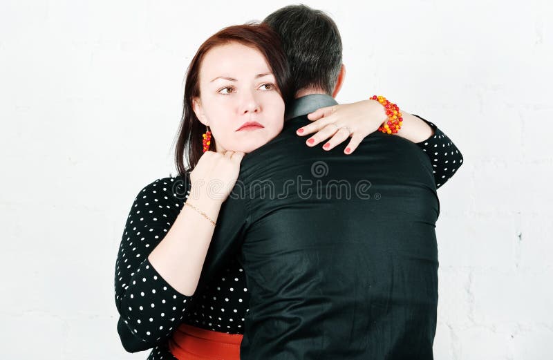 Woman hugging and comforting her man. Woman hugging and comforting her man