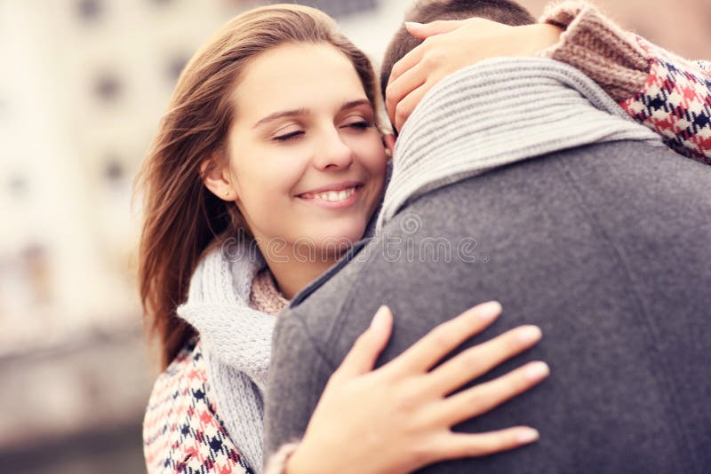 A picture of a beautiful women comforting a man. A picture of a beautiful women comforting a man