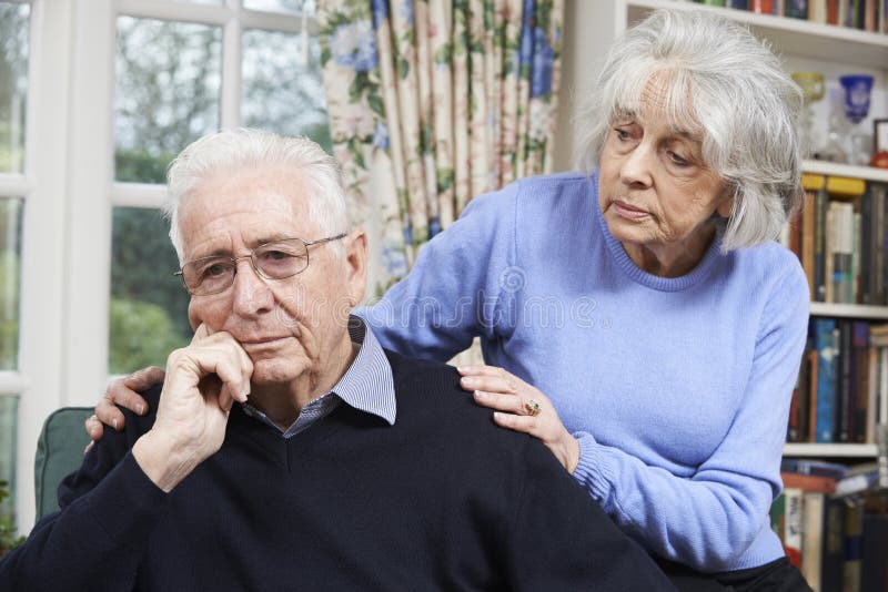 Senior Woman Comforting Senior Man With Depression