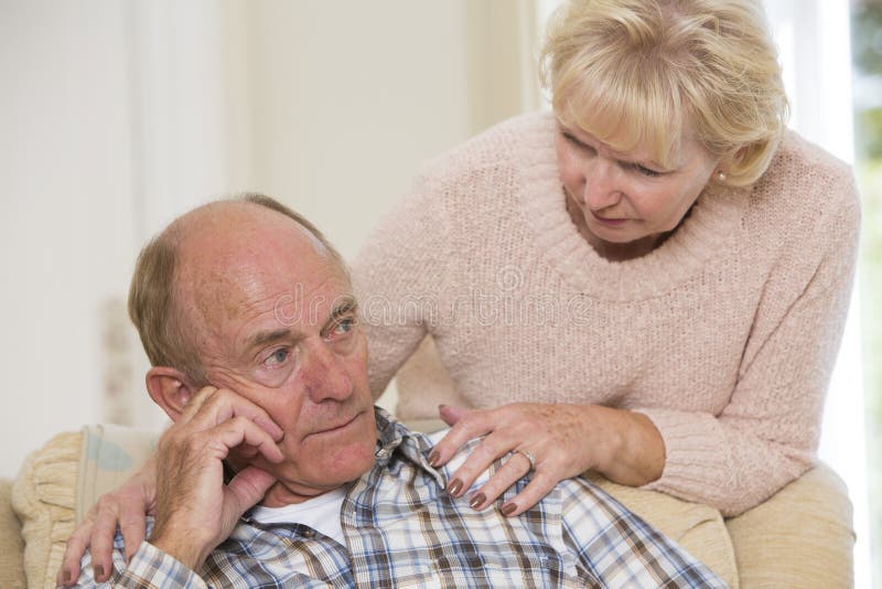 Senior Woman Comforting Senior Man With Depression