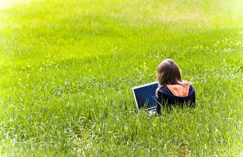 Woman connected on the grass