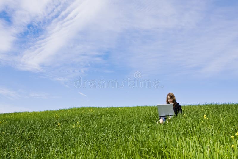 Woman connected on the grass