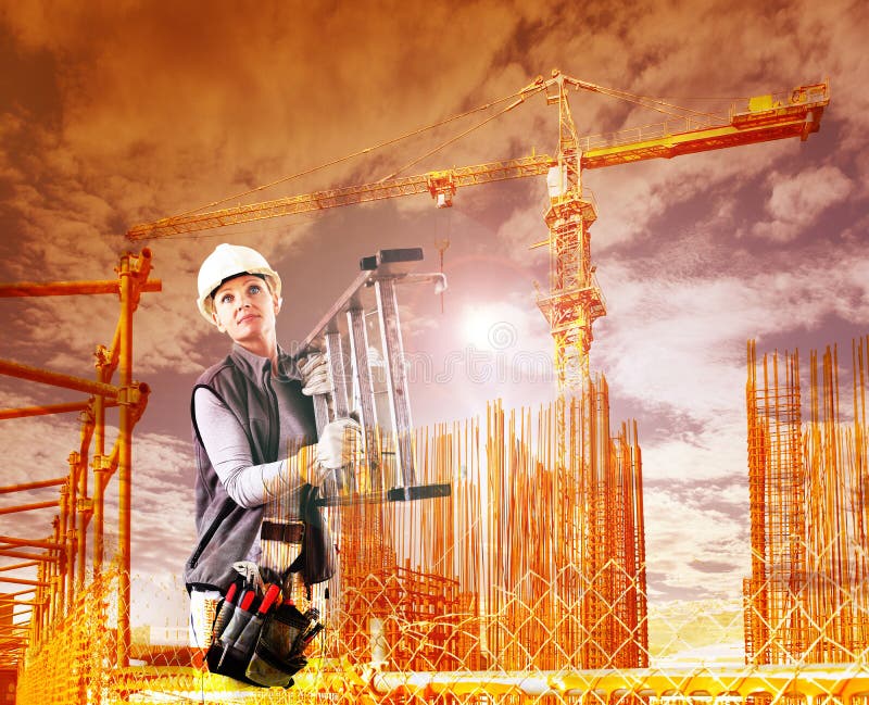 Woman construction worker on building site with crane with safety hard hat, tool bag and ladder, double exposure sky background royalty free stock image
