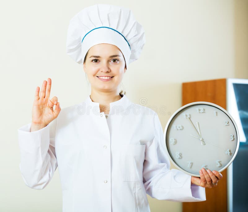 Woman the cook with clock stock image. Image of kitchen 64548949