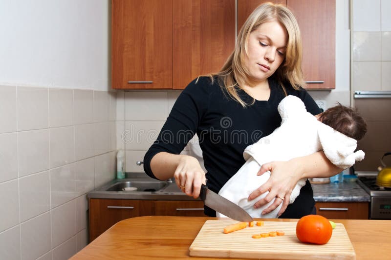 Funny young housewife cooking in kitchen Stock Photo - Alamy