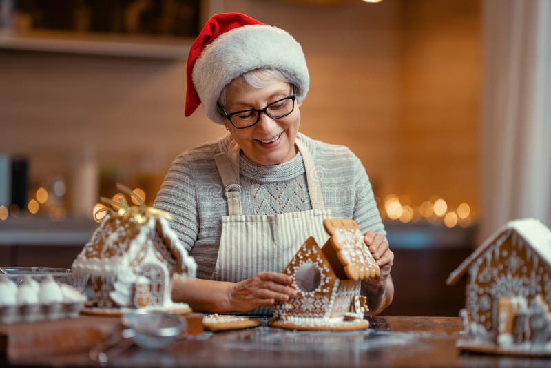 Woman cooking gingerbread house