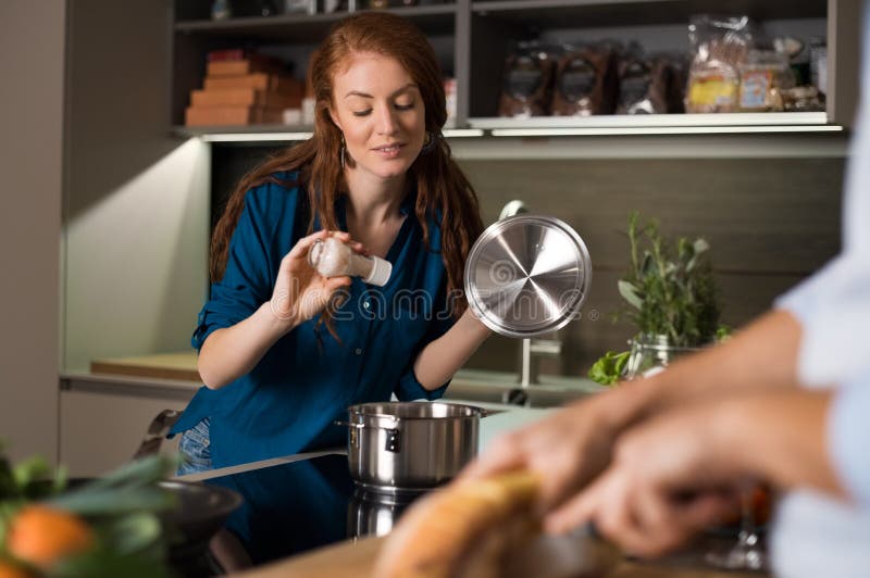 Young Couple In The Kitchen Cooking Dinner Stock Photo Image Of Food