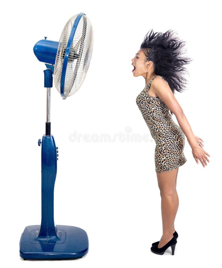 Woman is cooled by fan royalty free stock photography