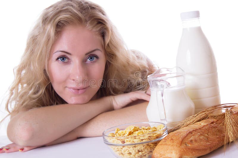 Woman with corn flakes and milk