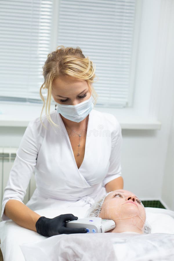 A Woman In A Cosmetology Office Receives A Smas Lifting Procedure Non