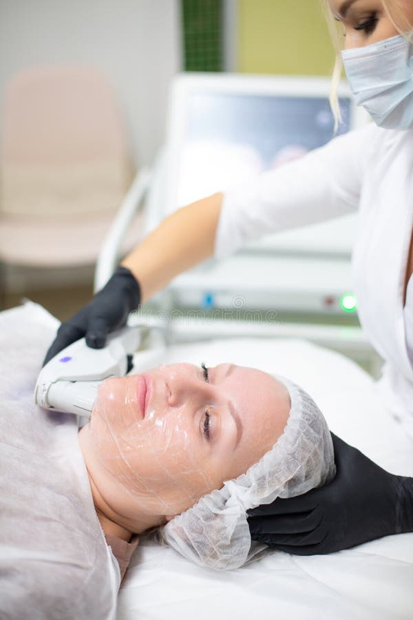 A Woman In A Cosmetology Office Receives A Smas Lifting Procedure Non