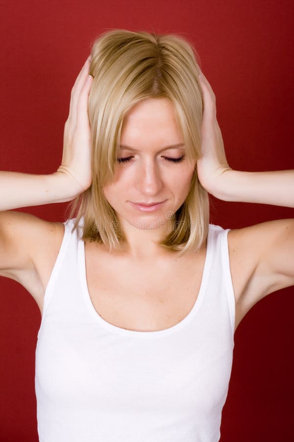 Woman covering her ears