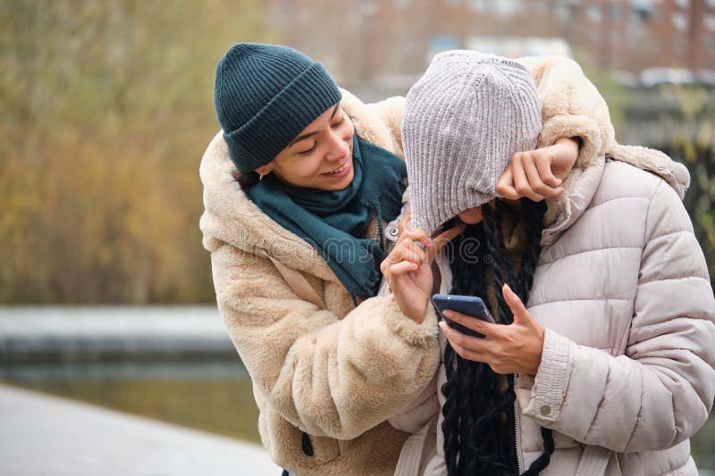 Dominican Lesbian Couple Showing Affection And Love At Street In Winter 