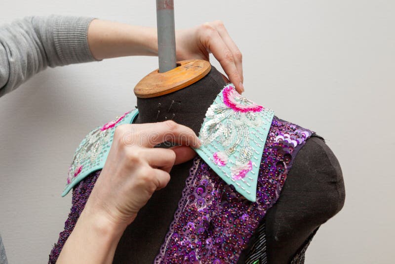 A woman creates exclusive clothes. royalty free stock photos