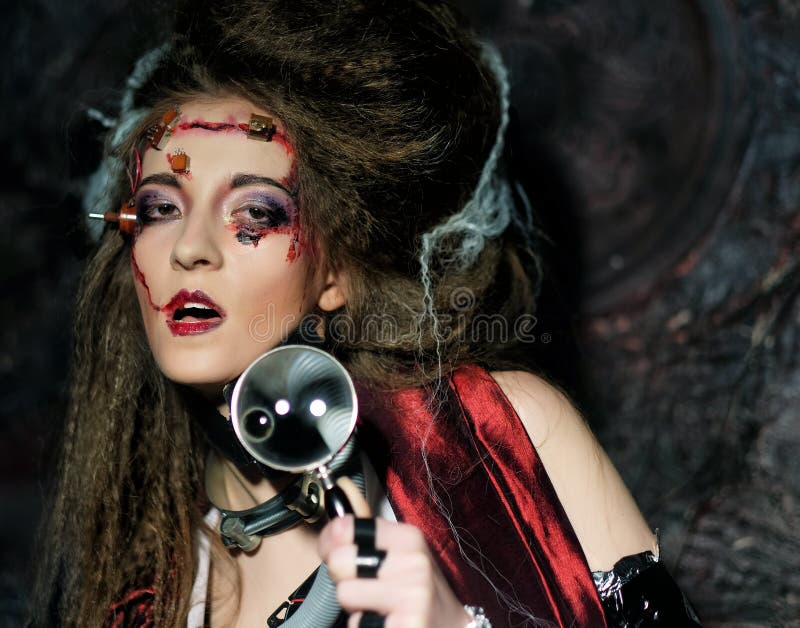 Woman With Creative Make Up Holding A Magnifying Glass Stock Image