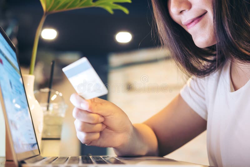 Woman and credit card stock photos Woman and credit card stock photos