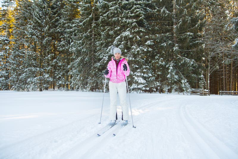 Woman Cross Country Skiing In Forest Stock Photo - Image of snow, girl ...
