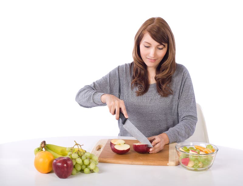 Woman cutting an apple