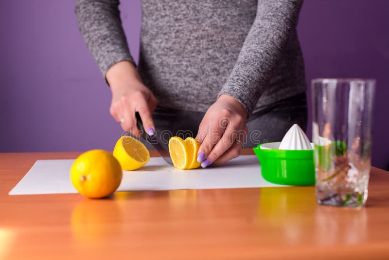 Woman is Cutting Lemon To Make Fresh Lemonade Stock Photo Image of