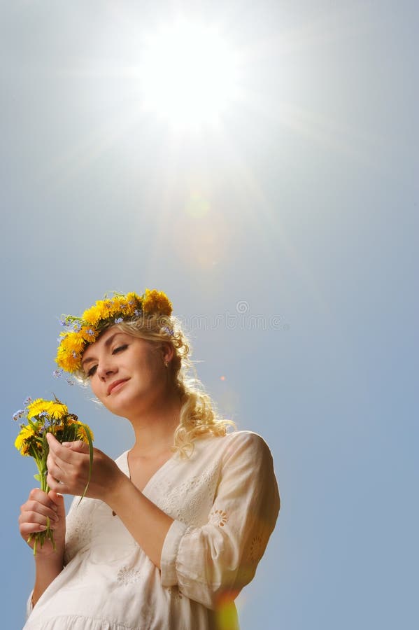 Woman with dandelion flowers