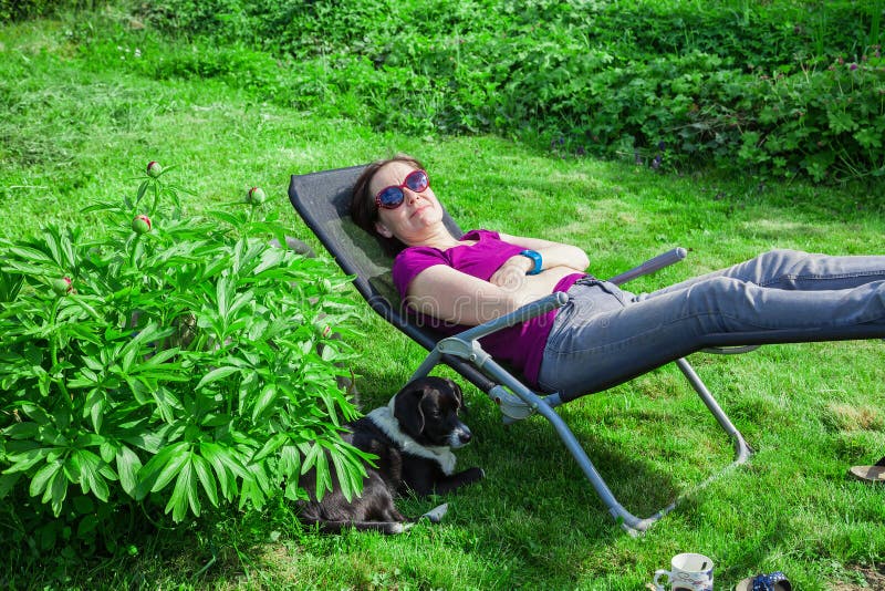 Woman in Deck Chair with Dog Stock Photo Image of deck, young 54585706