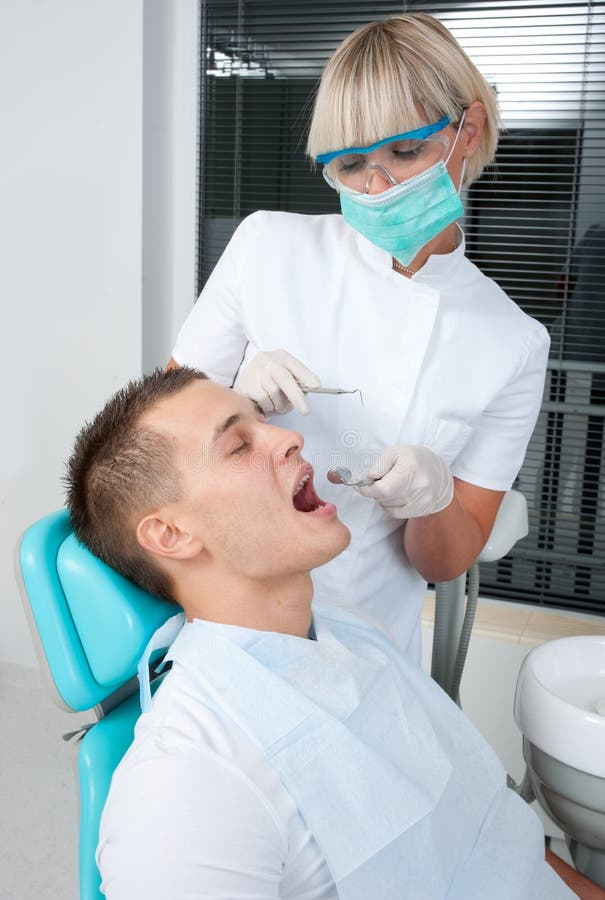 Woman dentist at work stock image. Image of dentist, instrument 21680839