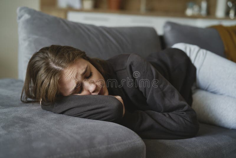 Woman with Depression Lying Down at the Sofa Stock Photo Image of