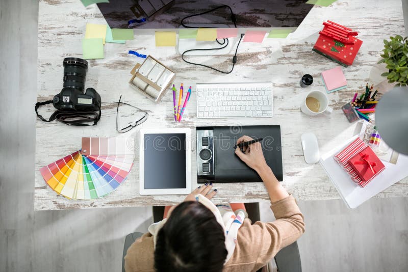 Woman designer working on the pen table royalty free stock photos