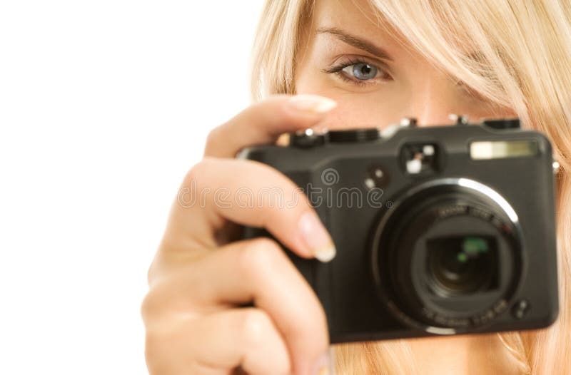 Beautiful smiling woman with digital camera. Isolated on white background