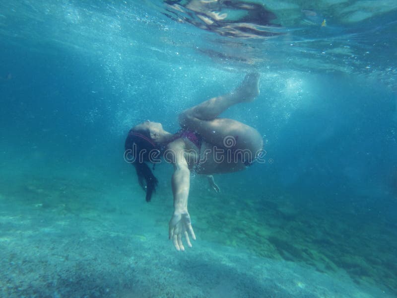 Woman diving underwater stock photos Woman diving underwater stock photos