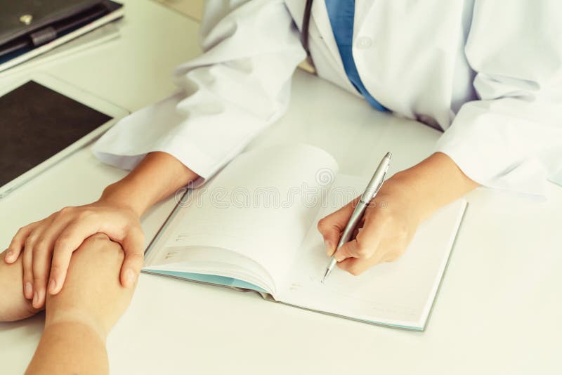 Woman Doctor and Female Patient in Hospital Office stock image Woman Doctor and Female Patient in Hospital Office stock image