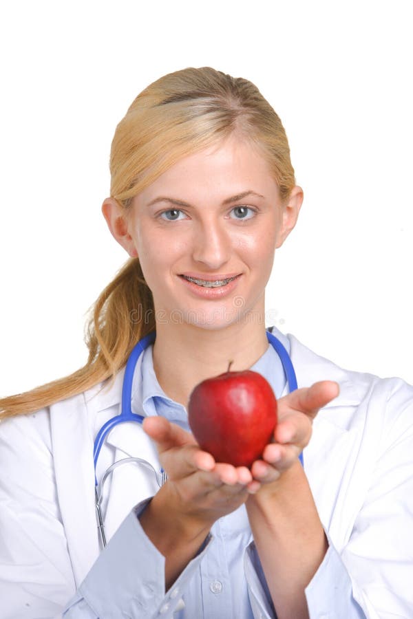 Woman doctor holding an apple