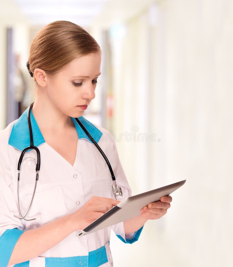 Woman Doctor holding a tablet computer