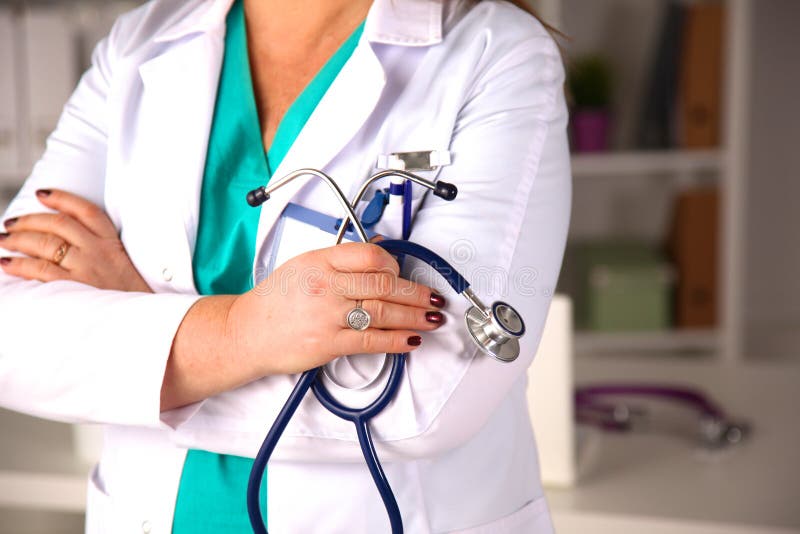 Woman doctor at the table in the office