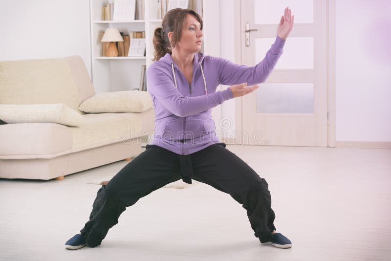 Woman Doing Qi Gong Tai Chi Exercise Stock Photo - Image of exercise ...
