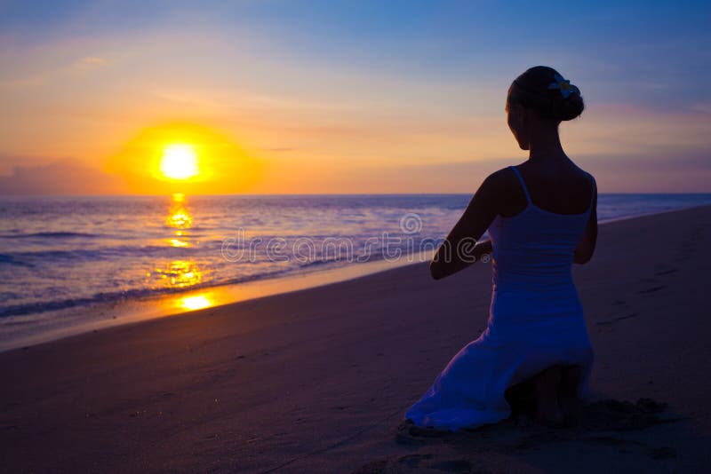 Woman doing yoga exercise outdoors