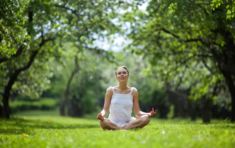 Woman doing yoga in natural environment