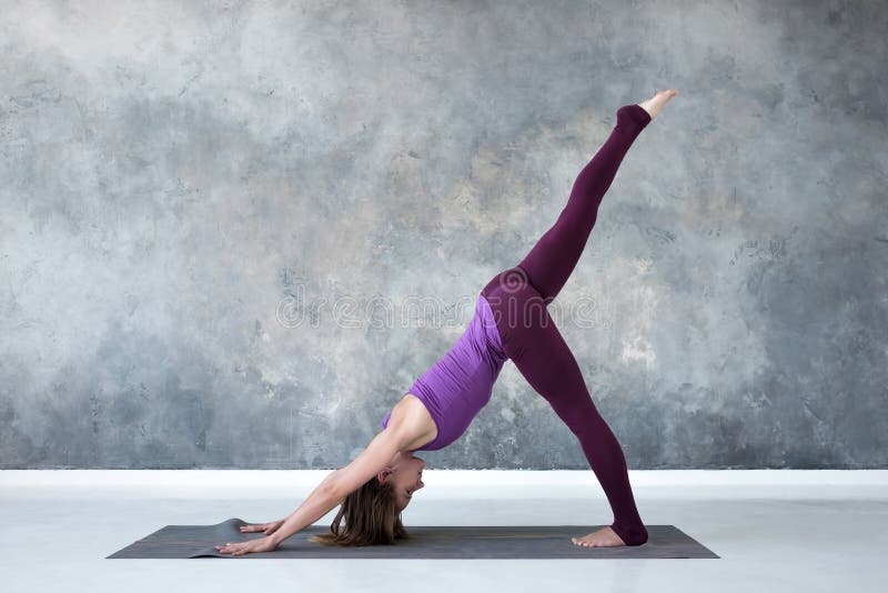 Two young women doing yoga asana double downward dog. Adho mukha svanasana  Stock Photo - Alamy