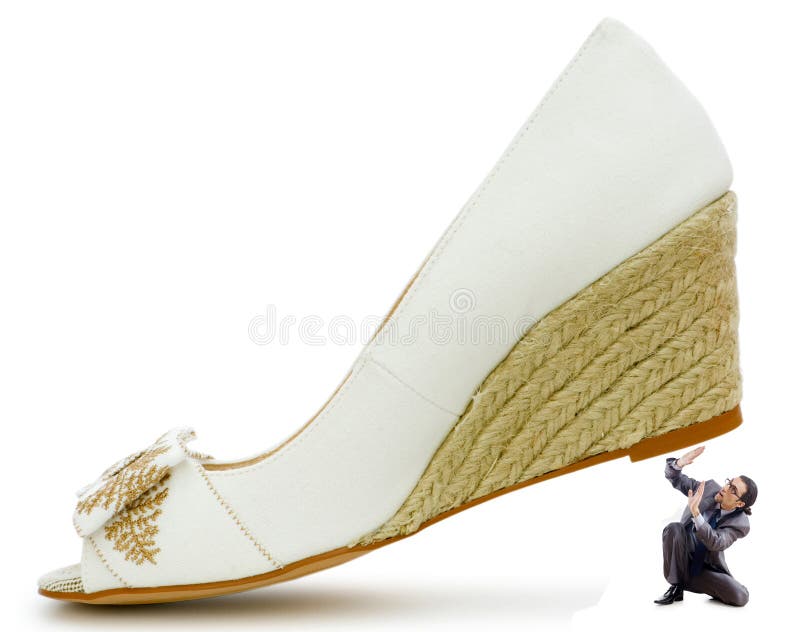 Woman domination concept - shoes and man stock image Woman domination concept - shoes and man stock image
