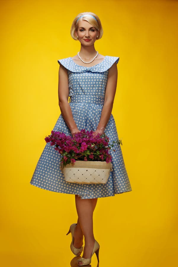 Woman in dress on yellow background