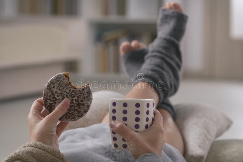 Woman with drink lying on sofa royalty free stock images Woman with drink lying on sofa royalty free stock images