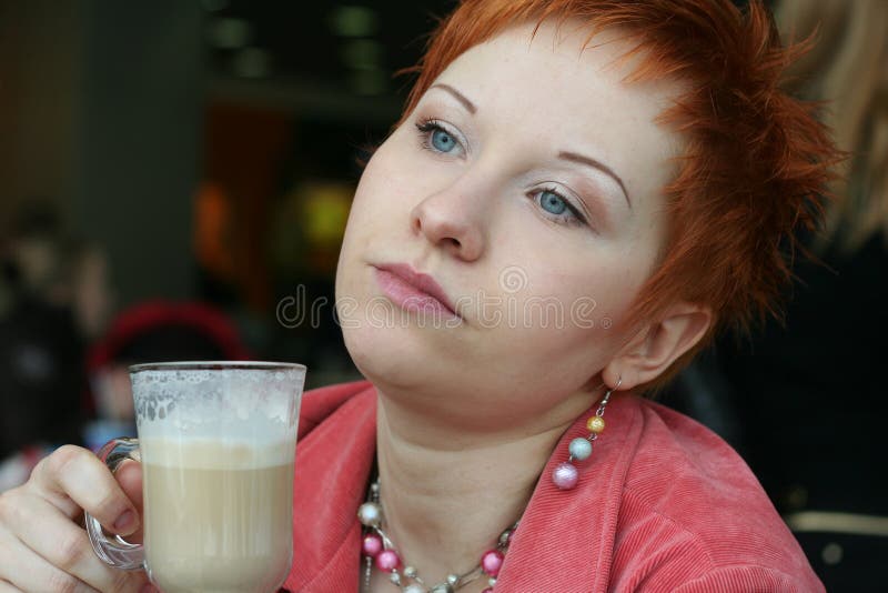 Woman drinking coffe in cafe