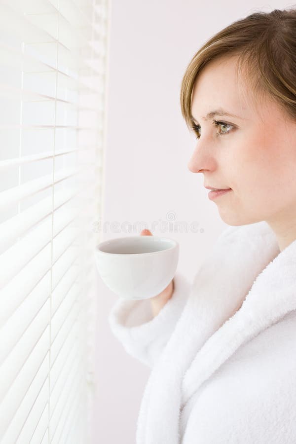 Woman drinking coffee stock image